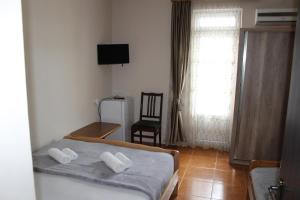 Voodi või voodid majutusasutuse Tornado Hotel toas