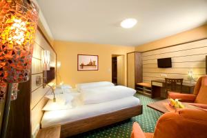 Postel nebo postele na pokoji v ubytování Kur- und Wellnesshotel Förch