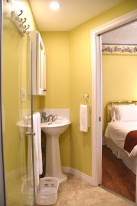 a bathroom with a sink and a shower at The Harbour House in Charlottetown +37 photos