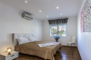 Кровать или кровати в номере FLH Albufeira Vila Mira Flat with Pool