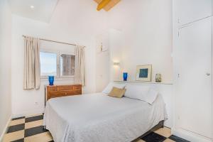 A bed or beds in a room at Beachfront Villa Es Clot by Sealand Villas
