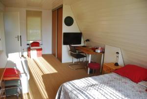 TV a/nebo společenská místnost v ubytování B&B-Edam