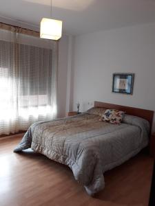 Posteľ alebo postele v izbe v ubytovaní Apartamento Parque de Quevedo