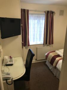 A television and/or entertainment center at The Justin James Hotel 