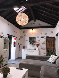 a living room with a couch and a table at Casa Doña Carmen in Betancuría