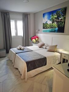 Posteľ alebo postele v izbe v ubytovaní Hostal Bodega
