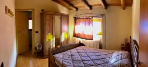 Un pat sau paturi într-o cameră la Agriturismo Cavria