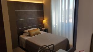 Postel nebo postele na pokoji v ubytování Hotel La Nuova Rotaia