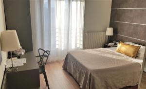 Postel nebo postele na pokoji v ubytování Hotel La Nuova Rotaia