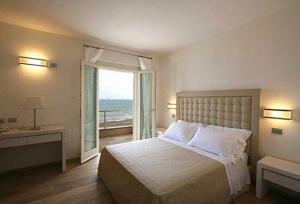 Postel nebo postele na pokoji v ubytování Hotel Alta La Vista