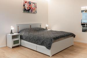 Ένα ή περισσότερα κρεβάτια σε δωμάτιο στο City center family relax apartment
