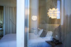 Postel nebo postele na pokoji v ubytování Hôtel Particulier le 28