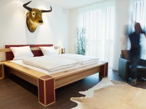 Ένα ή περισσότερα κρεβάτια σε δωμάτιο στο Das Quartier