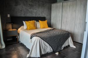 Giường trong phòng chung tại Premium Apart frente al Dique Los Molinos +45 ảnh