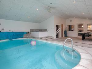 The swimming pool at or close to 15 person holiday home in Hals