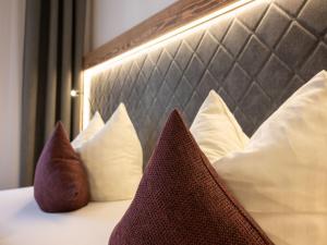 Łóżko lub łóżka w pokoju w obiekcie Hotel Stegerbräu