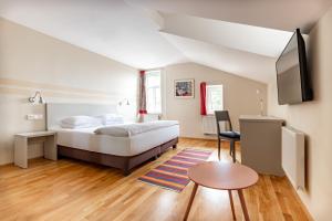 Posteľ alebo postele v izbe v ubytovaní Boutique Hotel SwissHouse