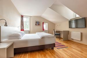 Posteľ alebo postele v izbe v ubytovaní Boutique Hotel SwissHouse