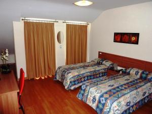 Giường trong phòng chung tại Hostal La Morada