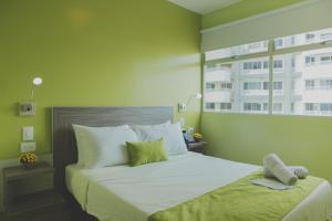 Postel nebo postele na pokoji v ubytování Hotel Aixo Suites By GEH Suites