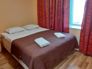Postel nebo postele na pokoji v ubytování Majaka Hostel