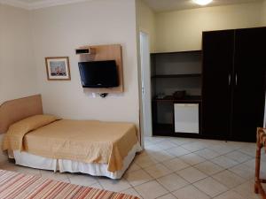 Cama ou camas em um quarto em Hotel Costa Balena