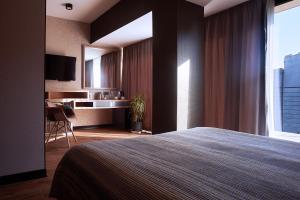TV a/nebo společenská místnost v ubytování Green Boutique Hotel