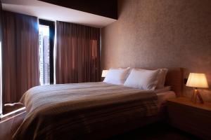 Postel nebo postele na pokoji v ubytování Green Boutique Hotel