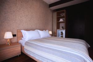 Postel nebo postele na pokoji v ubytování Green Boutique Hotel