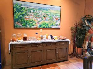 a table with food and drinks on top of it at Villa Mirasol in San Miguel de Allende