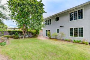 a house with a yard with chairs and a tree at Private Suite in San Diego