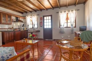 a kitchen and living room with a table and chairs at Casa Carolina 2 in Las Indias