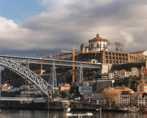 a bridge over a body of water at Guest House Douro in Porto