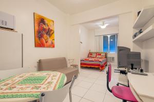 a hospital room with a bed and a couch at Apartamento Posto 6 in Rio de Janeiro