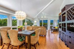a dining room with a table and chairs at Villas of Kamalii 43 condo in Princeville +28 photos