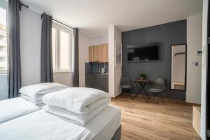 Postel nebo postele na pokoji v ubytování HostGost Selected Suites - Botanical Garden