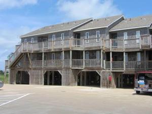 a large apartment building with a large deck at SW 1 STARFISH condo in Hatteras