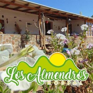 een bord voor een tuin voor een huis bij Hostal los Almendros de Canela in Canela Baja