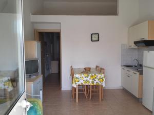 Kuchyň nebo kuchyňský kout v ubytování Long Beach Village Residence sul mare spiaggia privata inclusa