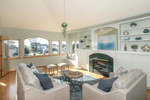a living room with two couches and a fireplace at Miramar Beach Home Walk to Beach Trails Restaurants Family Activities in Half Moon Bay
