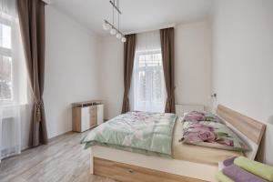 Una cama o camas en una habitación de Apartment Colibri