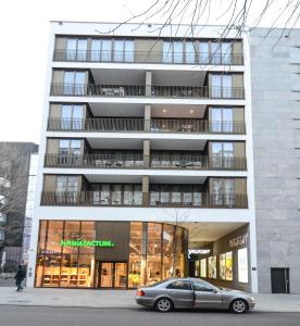 a car parked in front of a building at 2 · High-Quality in the heart of Stuttgart 2 in Stuttgart