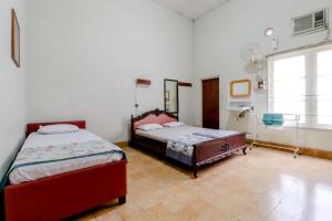 Katil atau katil-katil dalam bilik di Hotel Sumaryo