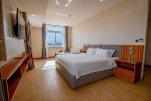 Postel nebo postele na pokoji v ubytování Bella Vita Hotel