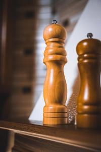 two wooden chess pieces sitting on a table at Tatova Hata in Yablunytsya