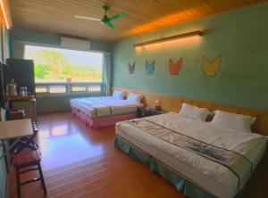 Postel nebo postele na pokoji v ubytování Ying Tian Ye Homestay