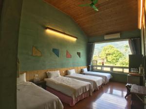 Postel nebo postele na pokoji v ubytování Ying Tian Ye Homestay