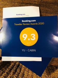 YU・CABIN tesisinde sergilenen bir sertifika, ödül, işaret veya başka bir belge