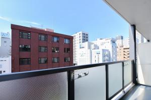 a balcony with a view of a city at momo premium 202 in Sapporo
