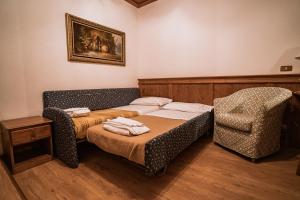 Postel nebo postele na pokoji v ubytování Hotel Sporting